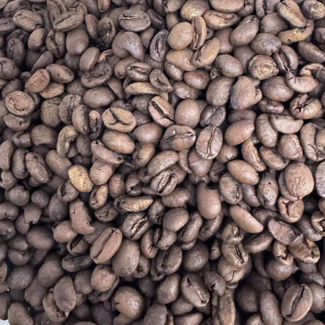 A pile of roasted coffee beans photographed from above.
